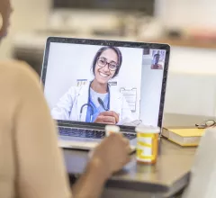 A patient has a telehealth visit with their doctor remotely in their home via video conferencing. The COVID-19 cause massive movement to telehealth since 2020.