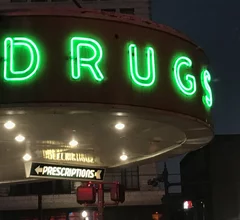 Vintage neon drug sign at the Walgreens pharmacy on Canal Street in downtown New Orleans.