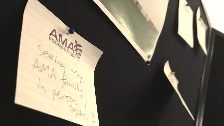 A note posted on a message board in the booth of the AMA Foundation, saying is it good to be back in person at the AMA House of Delegates meeting after two years of COVID. #AMA #AMA22 #AMA2022 #AMA175 #AMAmtg