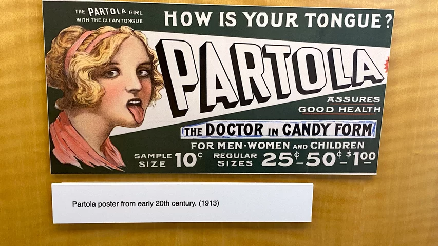 Partola medicine ad from 1913 alleging it cleans your tongue and boosts your health. Part of quackery, snake oil, medical frauds display at the AMA headquarters.