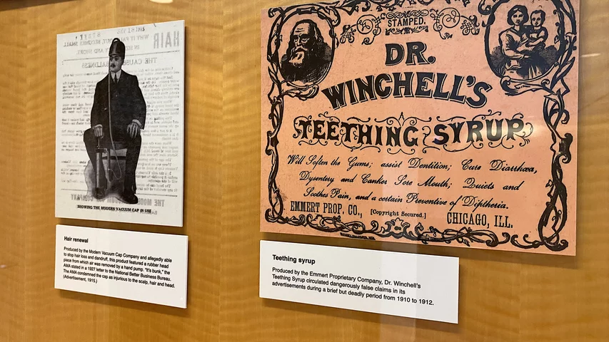 Left, an early 20th century advertisement for a hair growth device that the AMA fought to remove from the market because because it did not work and it caused damage to the patient's scalp, hair and head. Right, a teething syrup marketed for children that included dangerous, even deadly, false claims between 1910-1912.Part of quackery, snake oil, medical frauds display at the AMA headquarters.