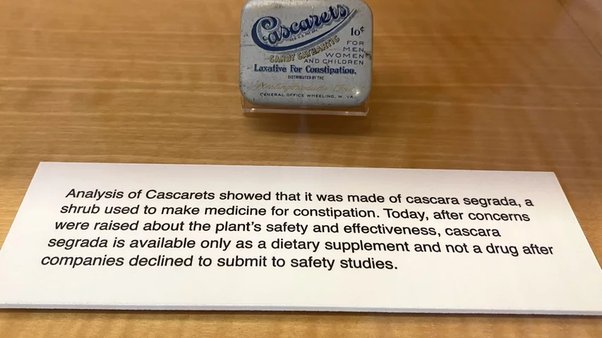 PThe drug Cascarets was made of cascara segrada, a shrub used to make medicine for constipation. However, after concerns were raised about the plant's safety and effectiveness, cascara segrada is available today only as a dietary supplement and not a drug after companies declined to submit to safety studies. art of quackery, snake oil, medical frauds display at the AMA headquarters.