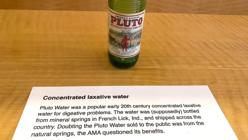 Pluto Water was a popular early 20th century concentrated laxative water for digestive problems. The water was supposedly bottled from mineral springs in French Lick, Indiana. Doubting the Pluto Water sold to the public was from the natural springs, the AMA questioned its health benefits.Part of quackery, snake oil, medical frauds display at the AMA headquarters.