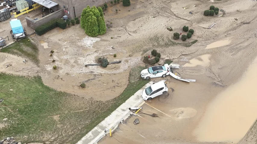 Employee cars that were carried away in the swift flood currents and debris around the Baxter North Cove facility. Photo by Aerial Lens.