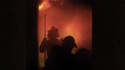 Firefighters during a training structure fire at Monroe Fire School in Wisconsin. Photo by Dave Fornell