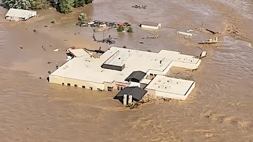 Helicopters rescue staff and patients from the roof of Ballad Health's Unicoi County Hospital in Erwin, Tennessee after a flash flood overtook the hospital with raging waters 5-8 feet high.Virginia State Police photo