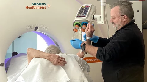 Technologist sets up a patient for a cardiac CT scan with IV iodine contrast contrast at Wellstar Kennestone Hospital in Marietta, Georgia. Photo by Dave Fornell