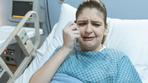 hospital patient in distress crying