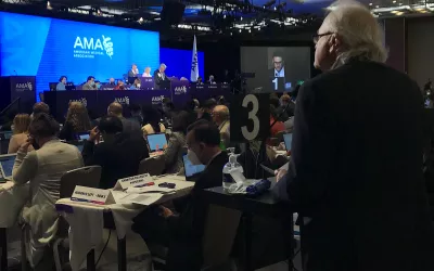 A delegate addresses the House of Medicine during discussion on a resolution at the AMA House of Delegates 2022 meeting.