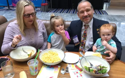 Balancing the work/personal-life responsibilities at the American Medical Association (AMA) 2022 meeting, Louisiana State Medical Association delegate Luis Alvarado, MD, eats lunch with his wife and two daughters at the AMA meeting in Chicago. His wife is a pharmacist, so they both have had to adjust as clinicians to the life of having kids while in clinical practice. Alvarado is involved with internal medicine. AMA #AMA22 #AMA2022 #AMA175 #AMAmtg