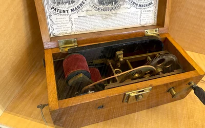 Americans' fascination with the mystery and promise of electricity made medical electric devices popular during the 19th century. The Davis & Kidder Patent Magneto-Electric Machine for Nervous Diseases was a device that when the crank was turned gave anyone holding the electrodes a high-frequency current. The makers claimed it relieved pain and cured numerous diseases, including cancer, tuberculosis, diabetes, gangrene, heart disease. Part of quackery display at the AMA headquarters.
