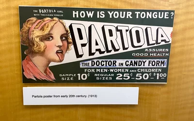 Partola medicine ad from 1913 alleging it cleans your tongue and boosts your health. Part of quackery, snake oil, medical frauds display at the AMA headquarters.