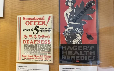 Quackery medicine advertisements to cure deafness and cure all aliments of women. Part of quackery, snake oil, medical frauds display at the AMA headquarters.