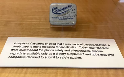 PThe drug Cascarets was made of cascara segrada, a shrub used to make medicine for constipation. However, after concerns were raised about the plant's safety and effectiveness, cascara segrada is available today only as a dietary supplement and not a drug after companies declined to submit to safety studies. art of quackery, snake oil, medical frauds display at the AMA headquarters.