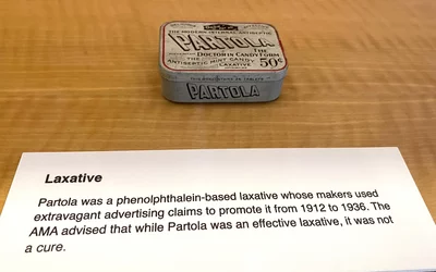 Partola was a phenolphthalein-based laxative whose makers used extravagant advertising claims to promote it from 1912 to 1936. The AMA advised that while Partola was an effective laxative, it was actually not a cure. Part of quackery, snake oil, medical frauds display at the AMA headquarters.