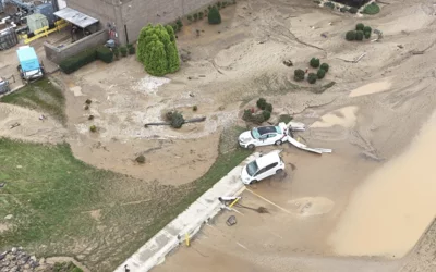 Employee cars that were carried away in the swift flood currents and debris around the Baxter North Cove facility. Photo by Aerial Lens.