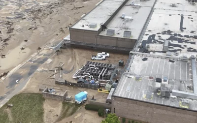 Mud and debris around the Baxter North Cove facility. Photo by Aerial Lens.