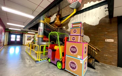 The Chocolate factory office building at Epic features a three story stairwell that replicates parts of the Willy Wonka chocolate factory production. Wiley Wonka themed office at Epic HQ. Photo by Dave Fornell