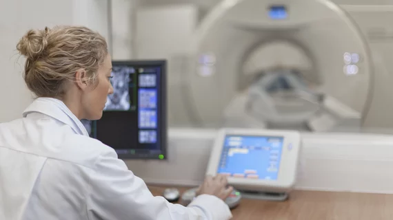 a doctor at a medical device control panel