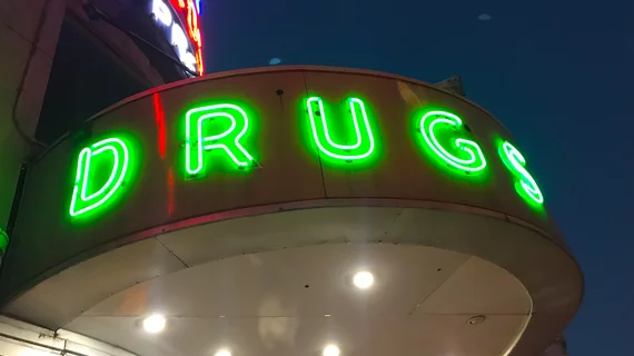 Vintage neon drug sign at the Walgreens pharmacy on Canal Street in downtown New Orleans.