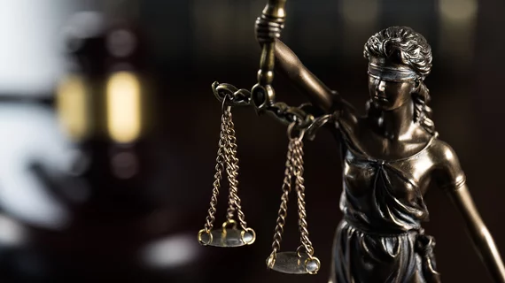 statue justice legal verdict malpractice case lawsuit scale